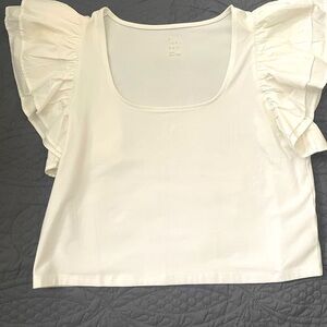Woman’s LARGE White slightly cropped ruffle top